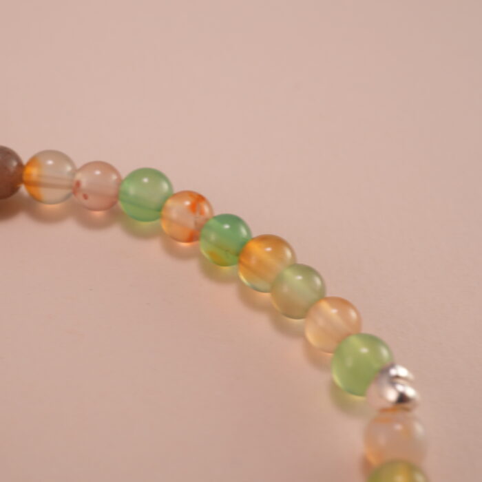 Close-up of 4mm chalcedony beads and star charm detail