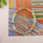 Bracelet styled on an open book with sunlight
