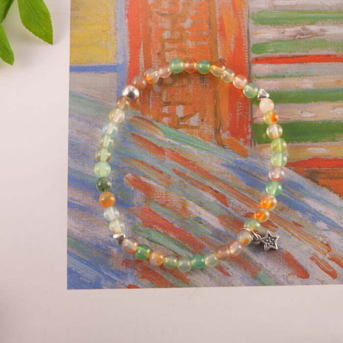 Bracelet styled on an open book with sunlight