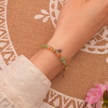 Wrist view of the yellow-green chalcedony star bracelet for layering look