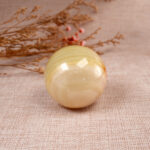 Close-up of natural jade gemstone sphere surface texture