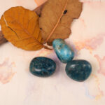 Blue Apatite Tumbled Stone Set displayed on natural wood background for meditation and healing