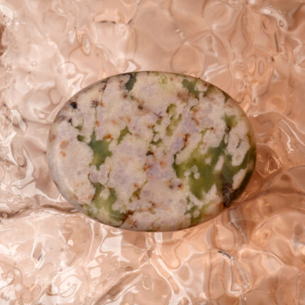 Green Cherry Blossom Agate worry stone with soft pink and green hues