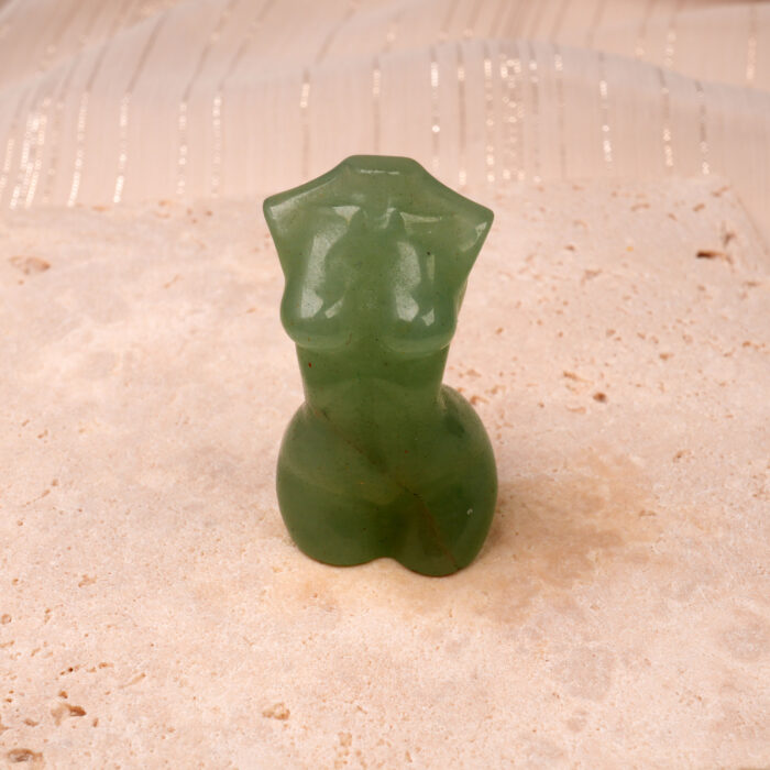 Polished Natural Green Onyx Model Figurine with rich green hues and smooth finish, displayed on a light surface