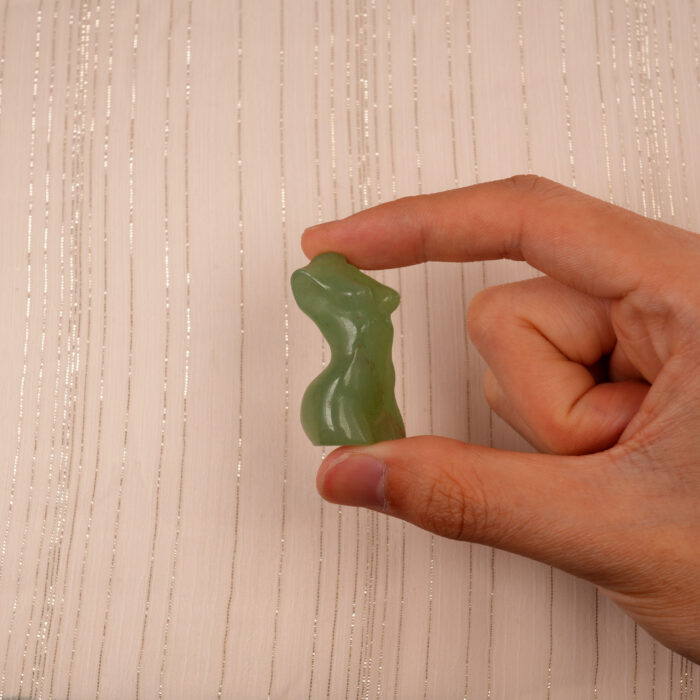 Hand holding Natural Green Onyx Model Figurine, showing its elegant shape and natural green color patterns