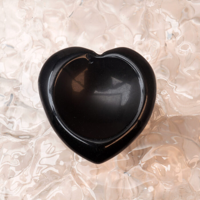 Smooth black obsidian heart-shaped worry stone