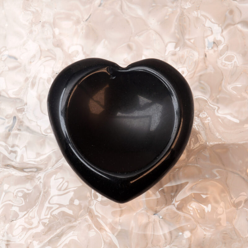 Smooth black obsidian heart-shaped worry stone
