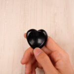 Smooth black obsidian heart-shaped worry stone