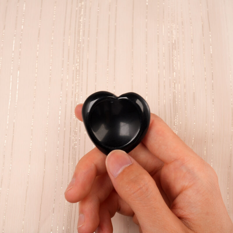 Smooth black obsidian heart-shaped worry stone
