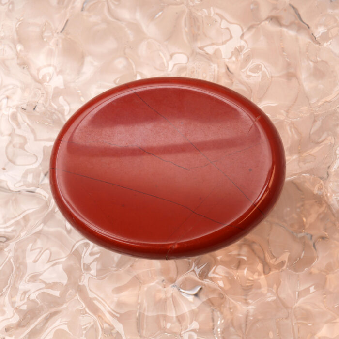 Polished Red Jasper worry stone with natural patterns