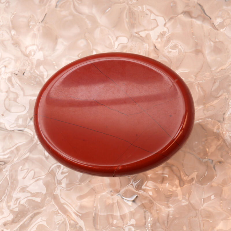 Polished Red Jasper worry stone with natural patterns