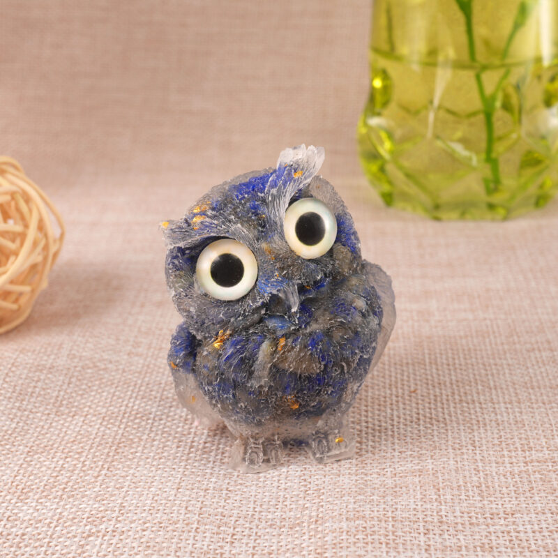 Lapis Lazuli resin owl figurine standing upright on white background