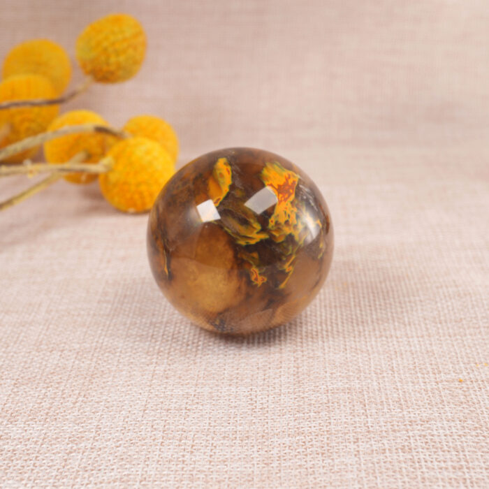 Tiger Skin quartz sphere placed on a desk or shelf as decorative crystal