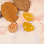 Natural Yellow Agate Tumbled Stone Set displayed in a serene setting, enhancing the ambiance with positive energy and natural beauty, ideal for home or office decor.