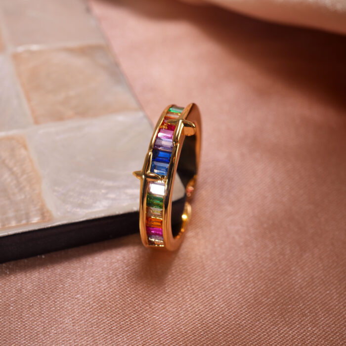 Rainbow Ring featuring vibrant zircon gemstones in multiple colors, displayed on a white background highlighting its brilliance