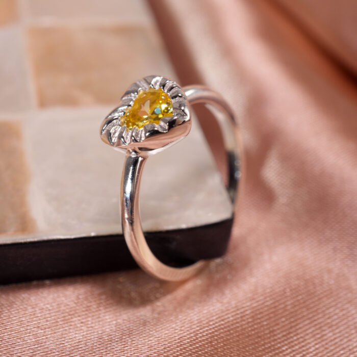 yellow-gemstone-ring-main.jpg" alt="Yellow Gemstone Ring featuring a vibrant yellow zircon set in S925 sterling silver, standing upright to highlight its elegant design and vibrant stone"