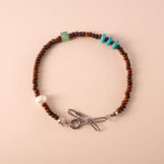Tiger Eye, Turquoise, and Pearl Bracelet featuring natural gemstones for protection, good luck, and emotional healing.