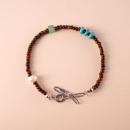 Tiger Eye, Turquoise, and Pearl Bracelet featuring natural gemstones for protection, good luck, and emotional healing.