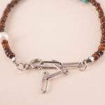 Close-up view of the Tiger Eye, Turquoise, and Pearl Bracelet, emphasizing the quality of the natural gemstones and adjustable design.