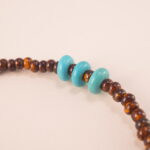Close-up view of the Tiger Eye, Turquoise, and Pearl Bracelet, emphasizing the quality of the natural gemstones and adjustable design.