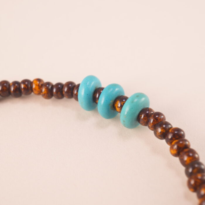 Close-up view of the Tiger Eye, Turquoise, and Pearl Bracelet, emphasizing the quality of the natural gemstones and adjustable design.