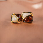 Close-up of each gemstone’s texture—Tiger Eye’s shimmer and Agate’s smooth calm