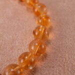 Close-up of faceted citrine beads and sterling silver accents