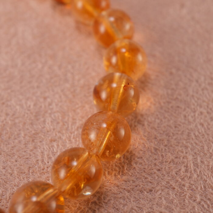 Close-up of faceted citrine beads and sterling silver accents