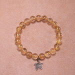 Golden rutilated quartz butterfly charm bracelet – 8mm crystal beads