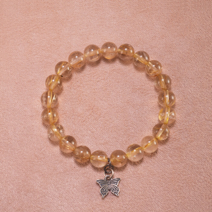 Golden rutilated quartz butterfly charm bracelet – 8mm crystal beads