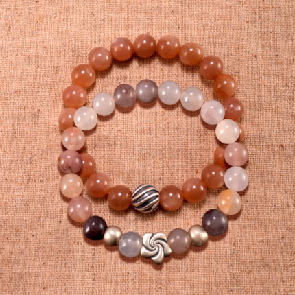 Main image showing stacked peach moonstone and aventurine S925 bracelets.