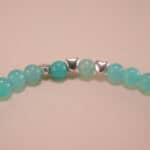 Close-up of amazonite bracelet with silver details.