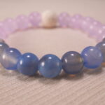 Close-up of amethyst and blue agate bracelet with lava beads.
