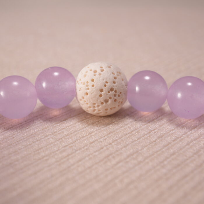 Close-up of amethyst and blue agate bracelet with lava beads.