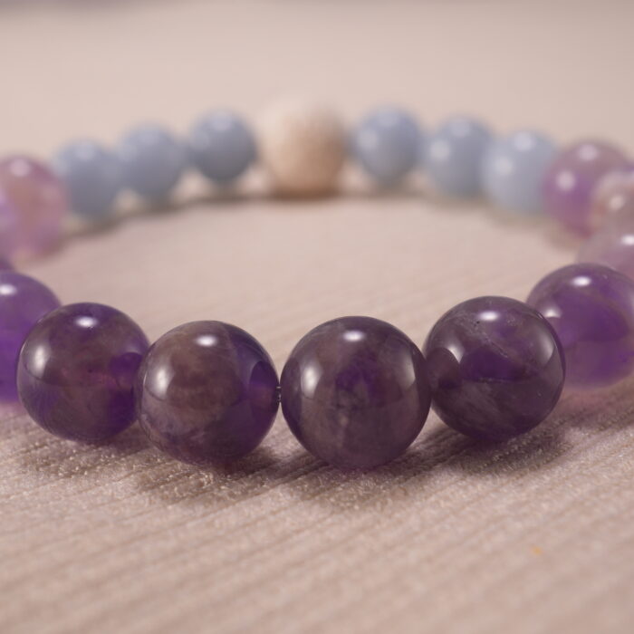 Close-up of amethyst and blue chalcedony bracelet with lava.