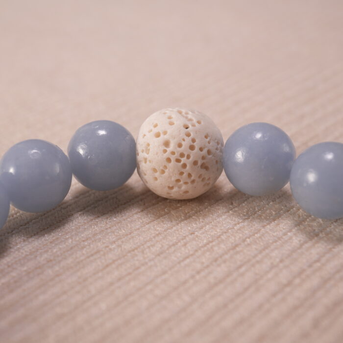 Close-up of amethyst and blue chalcedony bracelet with lava.