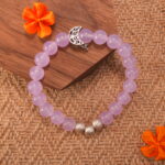 Close-up of amethyst bracelet with deep purple crystal beads.