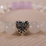 Close-up of amethyst and clear quartz bracelet with S925 silver.