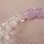 Close-up of amethyst and clear quartz bracelet with S925 silver.
