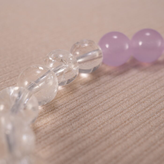 Close-up of amethyst and clear quartz bracelet with S925 silver.