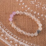 Bracelet in natural light showing soft purple and clear tones.