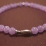 Close-up of amethyst bracelet with silver accents.