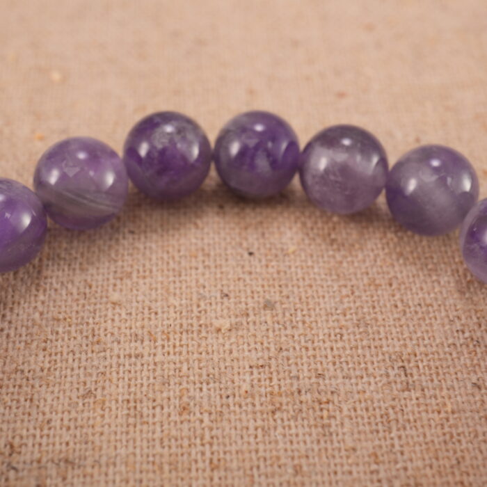 Close-up of amethyst bracelet with S925 silver beads.