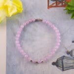 Amethyst bracelet in daylight with deep violet tone.