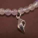 Close-up of amethyst and white chalcedony bracelet with silver.