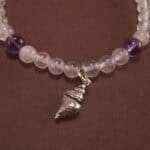 Close-up of amethyst and white chalcedony bracelet with silver.