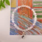 Bracelet in natural light with soft purple and milky white tones.