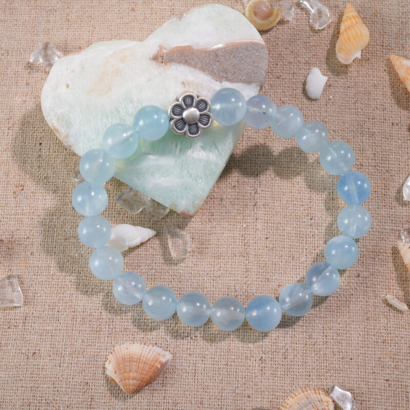 Aquamarine bracelet placed in natural light with ocean-inspired setting.