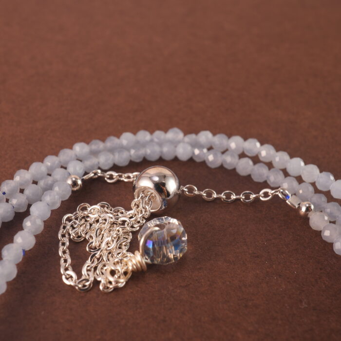 Close-up of aquamarine beads and clasp detail.