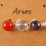 Full view of Aries zodiac necklace with natural gemstones.